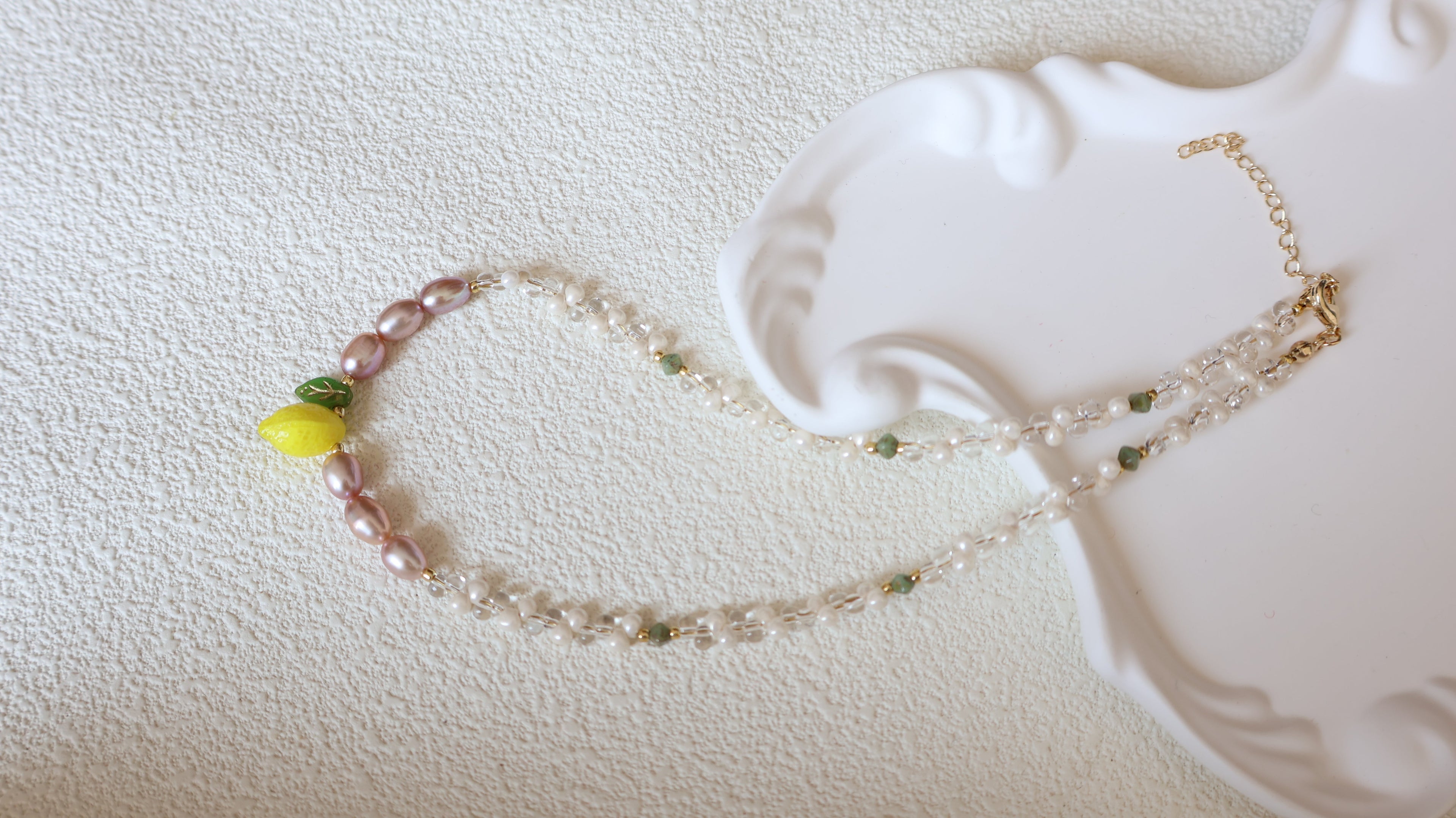 Freshwater pearl necklaces collection banner with classic and modern pearl pieces