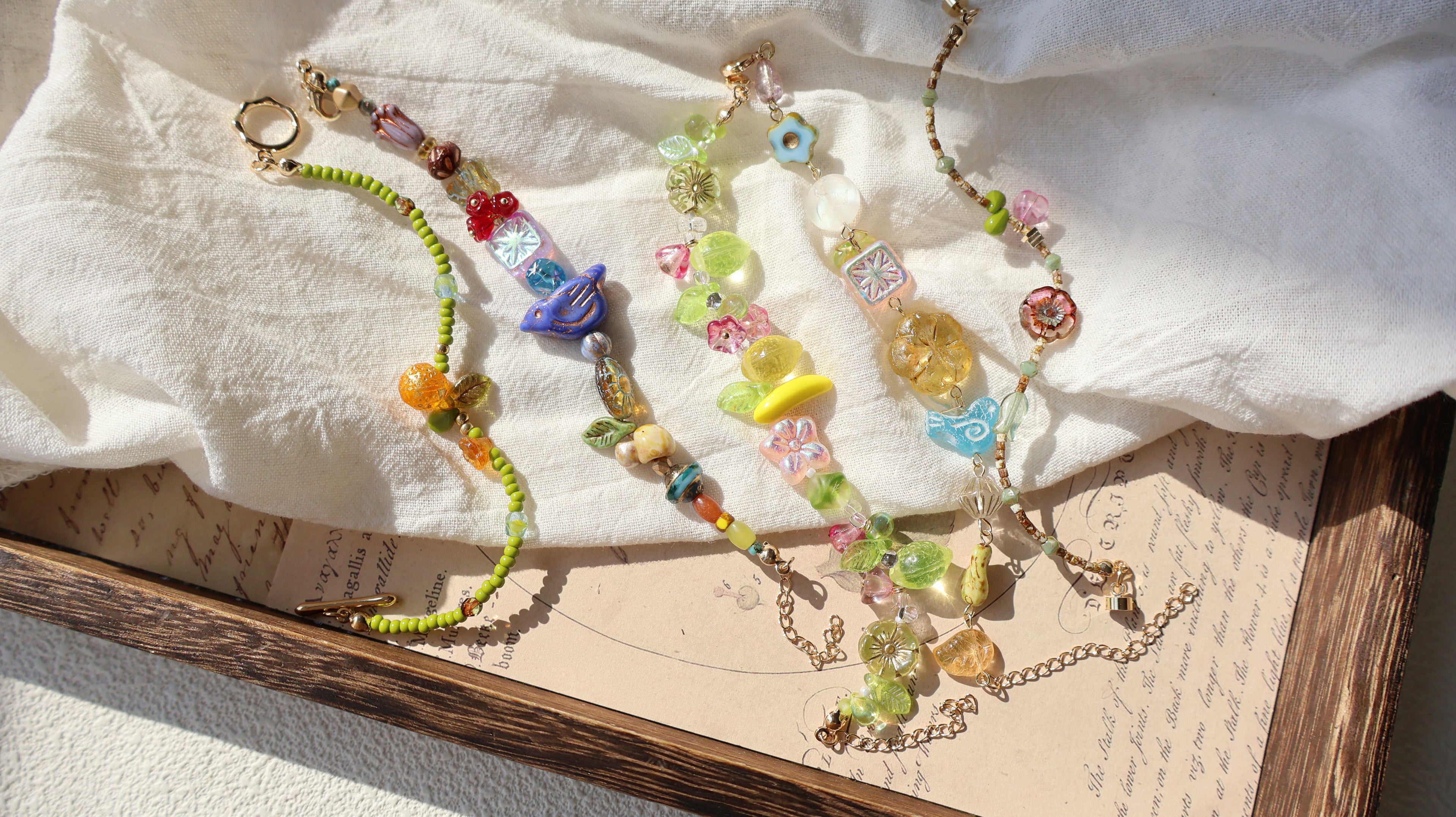 Glass bead bracelets collection banner featuring colorful handcrafted designs
