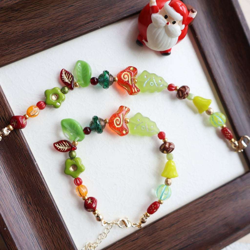 Colorful beaded necklace on a white surface with a wooden frame