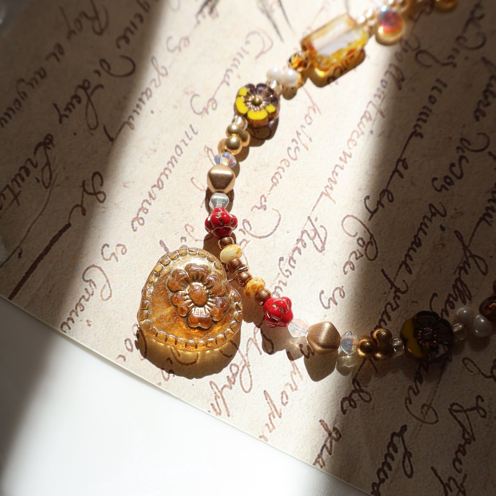 Decorative bracelet with beads on an old document
