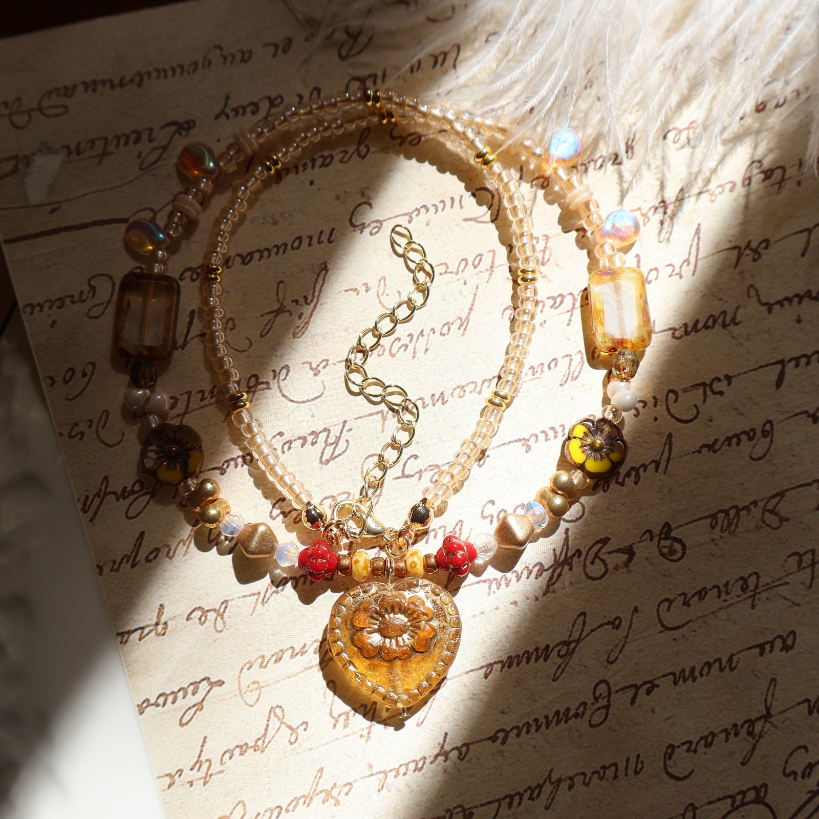 Decorative bracelet with beads on an old letter