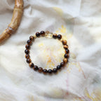 Beaded bracelet on a textured white fabric background