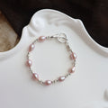 Pearl bracelet on a decorative white dish