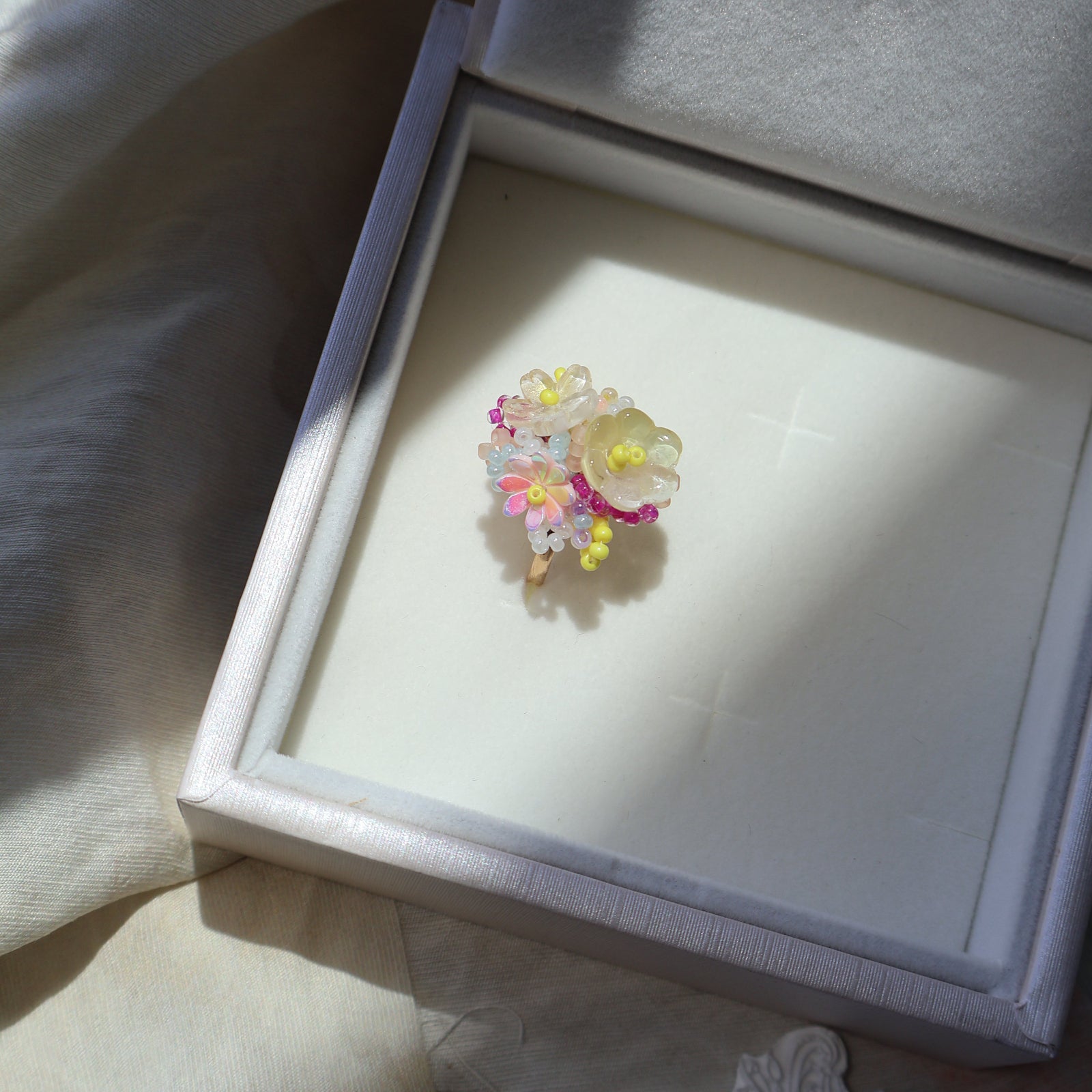 Decorative brooch in a jewelry box with a soft focus background