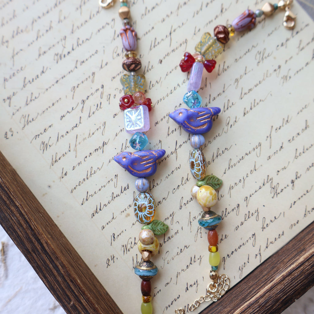 Colorful beaded necklace on an old document