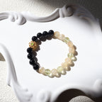 Multicolored beaded bracelet on a white decorative object