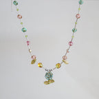 Necklace with multicolored beads on a light gray background