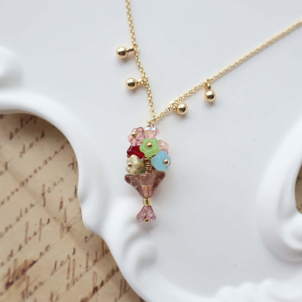 Necklace with colorful beads on a white surface