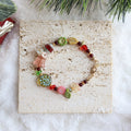 Colorful beaded bracelet on a textured card with decorative elements