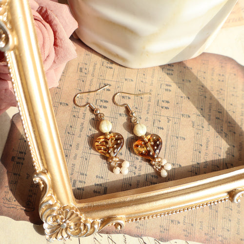 Amber Heart Drop Earrings made with Czech Glass Beads on a white background.