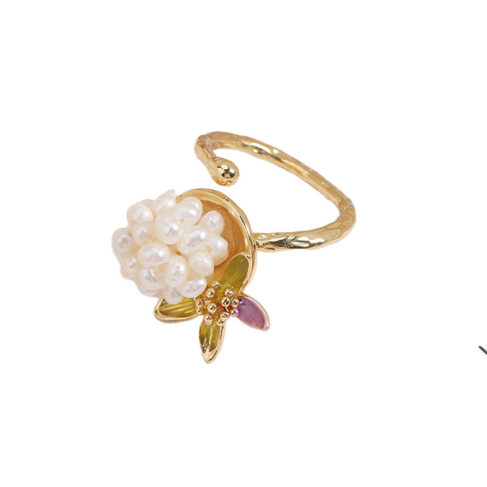Gold ring with pearl and gemstone design on a white background