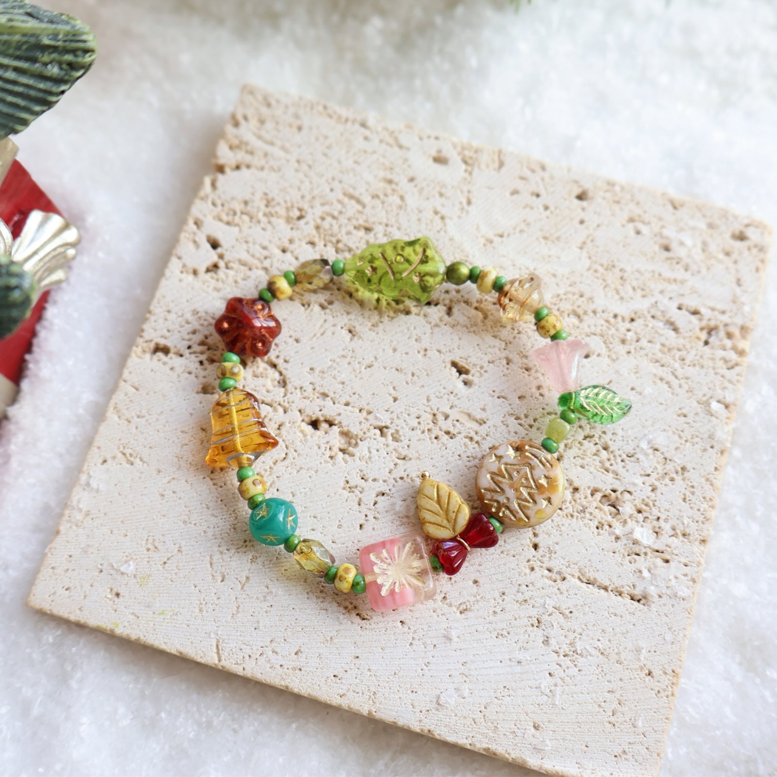 Colorful beaded bracelet on a textured surface