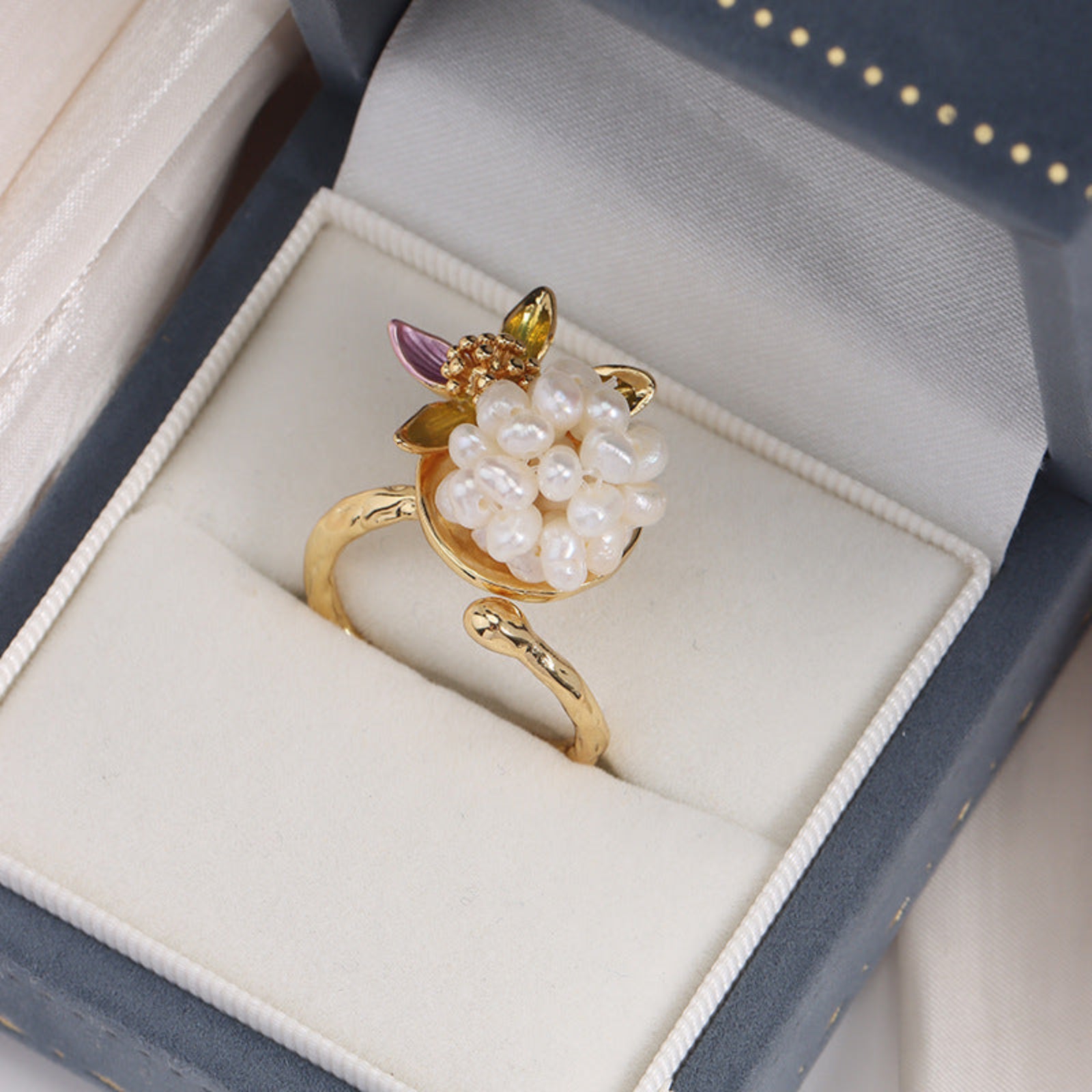 Gold ring with pearls in a jewelry box